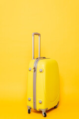 colorful travel bag on yellow background