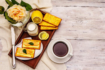 Healthy breakfast. Cup of coffee (black tea), milk, crackers with butter and salmon