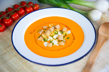 Veggie spanish Salmorejo. Cold tomato soup made with garlic, tomatoes, onion, bread and served with olive oil, deep fried tofu and boiled egg.