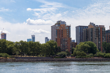 Modern Residential Buildings in the Roosevelt Island Skyline along the East River in New York City during Summer