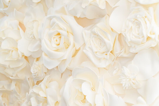 Artificial white rose buds for background and design. White floral background