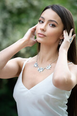 Beautiful young european woman with elegant earrings and necklace