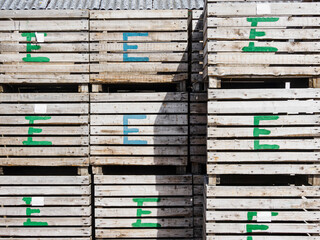 Wooden boxes marked with letter E