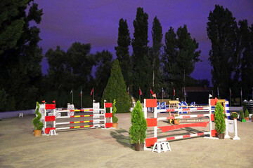 Show jumping hurdles on the race course at evening