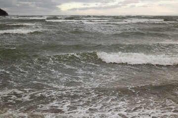 Raging ocean waves on a beach in fall