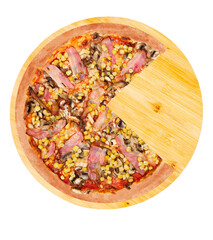 Delicious pizza with chicken breast, corn, bacon and mushrooms, without a quarter on a round wooden plate, isolated on white background, top view