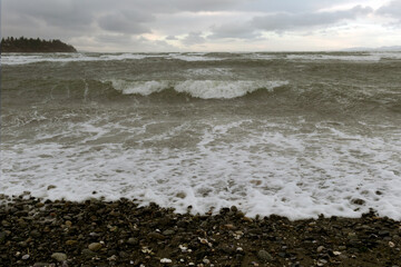 Raging ocean waves on a beach in fall