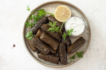 Dolma - stuffed grape leaves with rice. Traditional Caucasian, Turkish and Greek cuisine