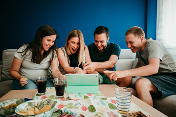 .Group of young friends making a video call from home. Taking care of social distance in times of covid19. Stay Home.