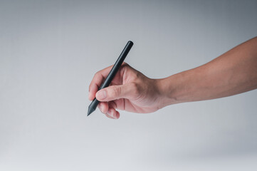 The man's hand showing the writing gesture on the tablet on the white background.