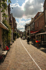 Deventer, Netherlands - July 11 2020: Famous Walstraat in the Dutch historic city center of Deventer
