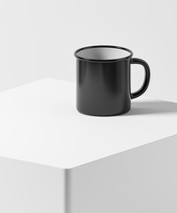 Black blank enamel mug on the white table.