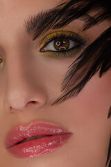Fototapeta premium Closeup of beauty woman with clean shiny skin and natural cosmetics. Beautiful extrem eyelash and plump lips of a well-groomed girl demonstrate spa procedures, injections in a beauty parlor