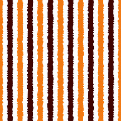 Halloween seamless striped pattern, vector illustration. Striped pattern with orange and brown vertical stripes. Halloween geometric background with rough lines