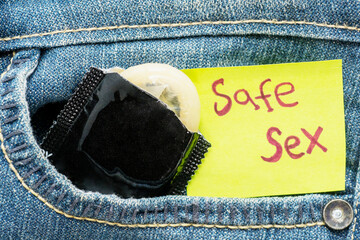 Condom with safe sex text in pocket pants