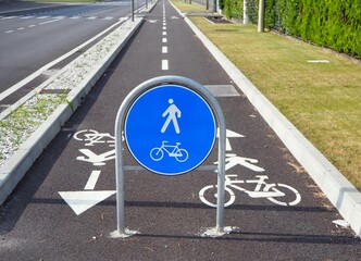 Straight two way cycle lane with traffic street signs. 