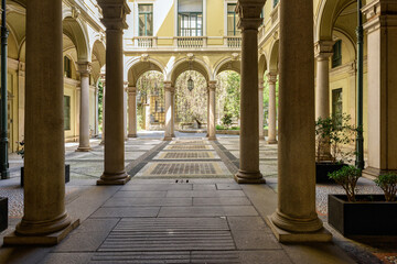 Fototapeta na wymiar Inner courtyard of an old building in the historical center of Milan, Italy.