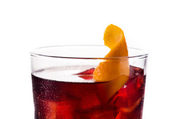 Boulevardier cocktail and orange zest isolated on white background