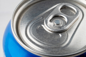 fore the closure of an aluminum can of soda