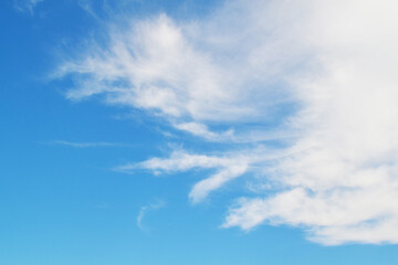 Naklejka na ściany i meble Blue sky on a sunny day, white clouds float by