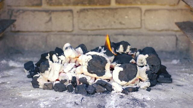 Coals burning in preparation for the barbeque