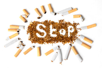 Many broken cigarettes with stop smoking word