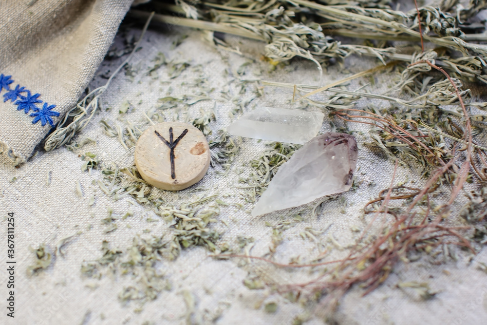 Wall mural scandinavian wooden rune algiz, elhaz on a rough linen cloth with amethyst crystalline, rock crystal