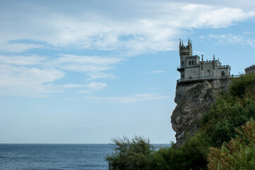 Fototapeta na wymiar Swallow's nest. A small castle on top of a cliff.