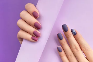 Acrylic prints Manicure Beautiful purple burgundy matte manicure on creative background