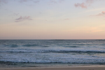 Obraz premium The oceans waves sand and sunset - Mekaki bay Lombok