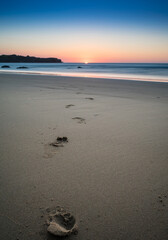 Walking to the sunset on the beach