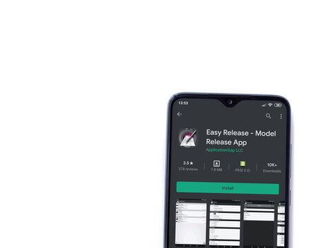 Lod, Israel - July 8, 2020: Easy Release Pro - Model Release app play store page on the display of a black mobile smartphone isolated on white background. Top view flat lay with copy space. 