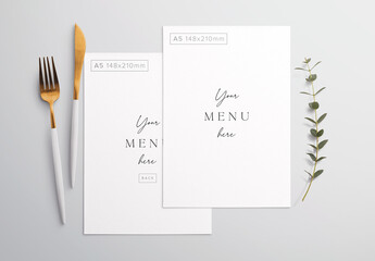 Menu on Table with Cutlery and Eucalyptus Mockup