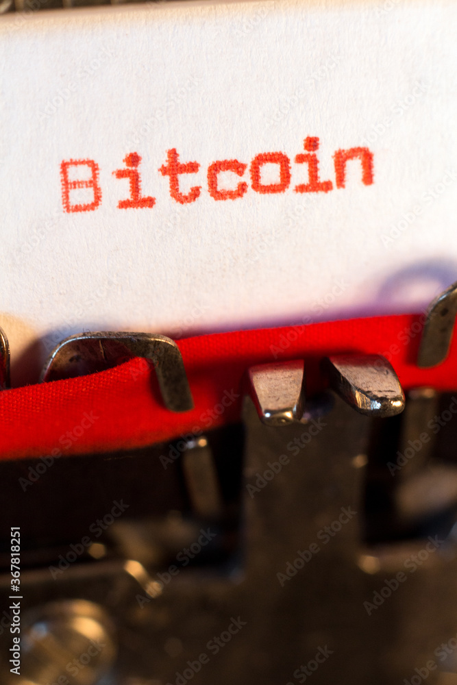 Fototapete bitcoin typed on typewriter on red. bitcoin is a cryptocurrency invented in 2008 by an unknown perso