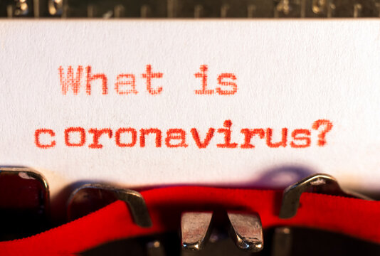 "What is coronavirus ?" on typewriter on red. Asking for information about de covid concept