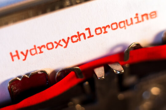 Hydroxychloroquine typed on typewriter on red, medication used to prevent and treat malaria in areas where malaria remains sensitive to chloroquine