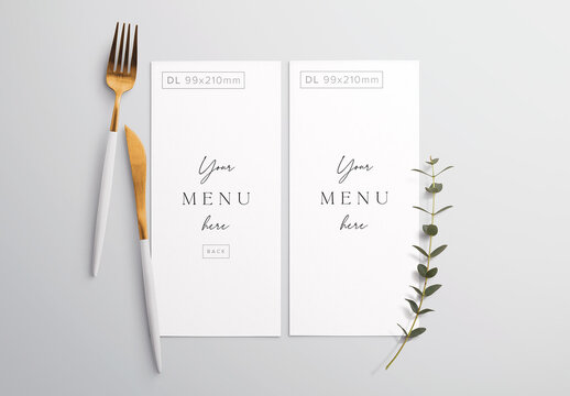 Menu on Table with Cutlery and Eucalyptus Mockup