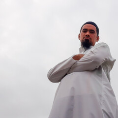 Asian Muslim businessman portrait wearing white arabian shirt