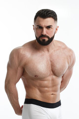Athletic bearded man with a naked torso isolated on white background.