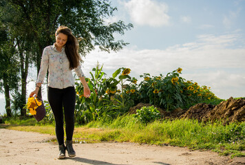 Smiling girl walking through a field