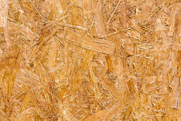 Wooden background.Textured wooden background made of pressed wood shavings of natural color.