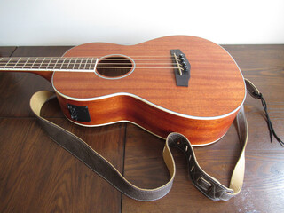 Acoustic Bass  Guitar on Table with Strap