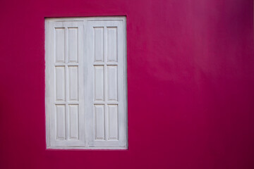 white wooden window on pink painted wall