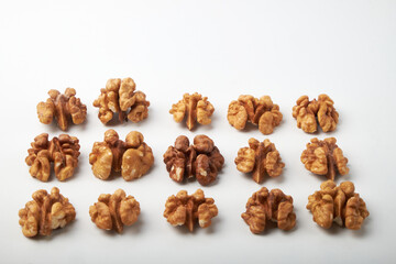 Walnut kernels on a wooden background.