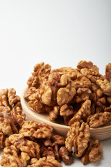 Walnut kernels on a wooden background.