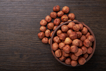 hazelnuts in a Cup on a wooden background