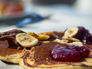Pancakes served with jam, cocoa spread and jam