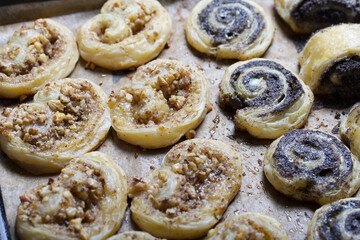 Freshly made curls stuffed with poppy and walnuts. Lie on a baking sheet.