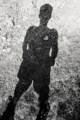 Stone heart in the shadow of a man