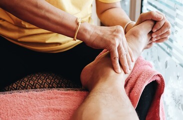 Close up of the traditional Thai foot massage, Foot pain treatment